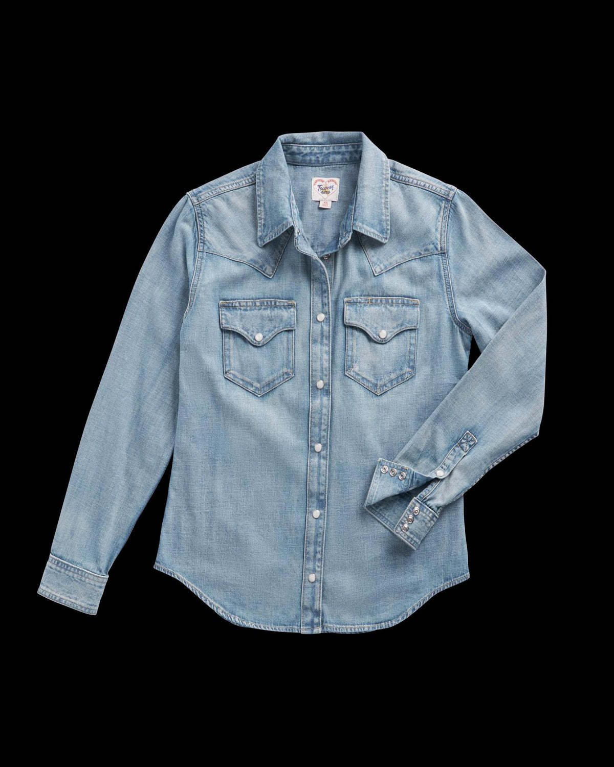 Light blue denim long-sleeve shirt with snap buttons, two front chest pockets, and pointed collar, displayed on a plain background.