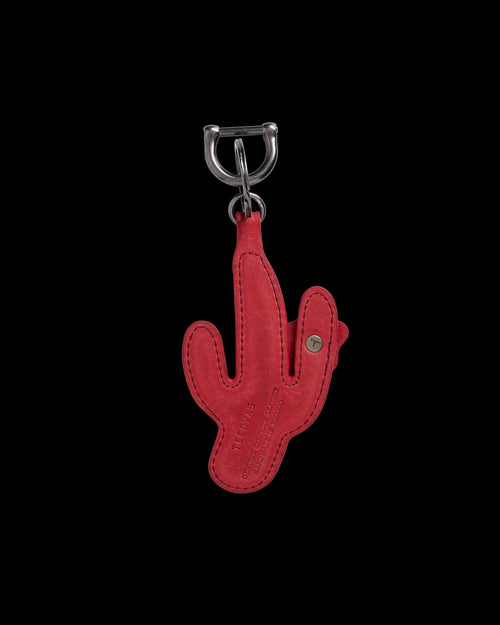 A red leather keychain in the shape of a cactus with embossed text and a metal clasp attached at the top.
