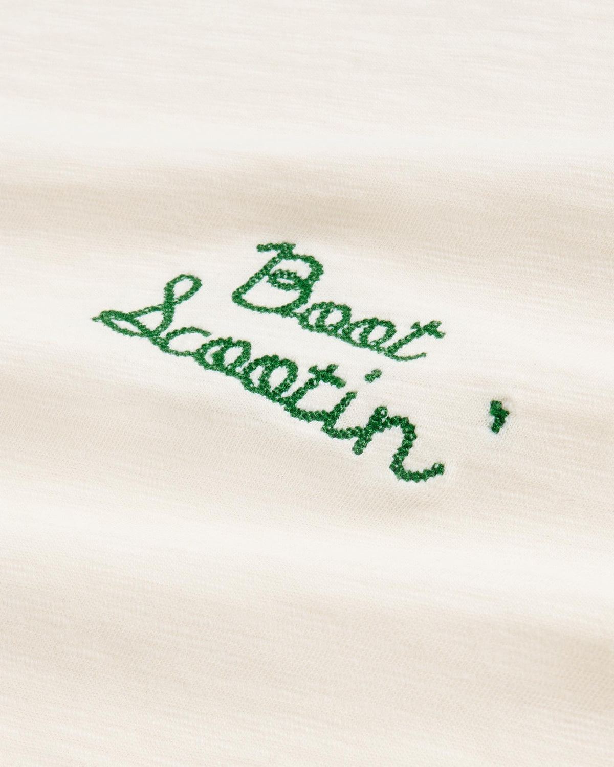 Closeup view of Women's Vintage Ringer Tee - Bone / Green
