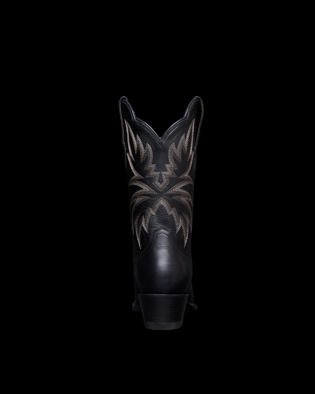 View of the back of the sadie boot in the color midnight. 
