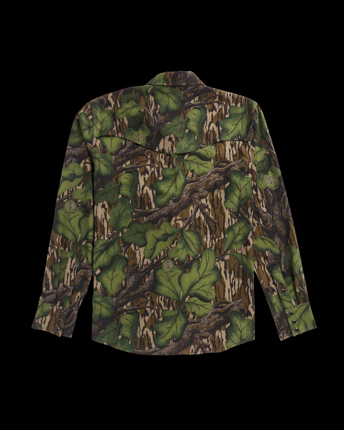 Long-sleeve button-up shirt with a green and brown camouflage pattern resembling leaves and branches, displayed flat with the back facing up.