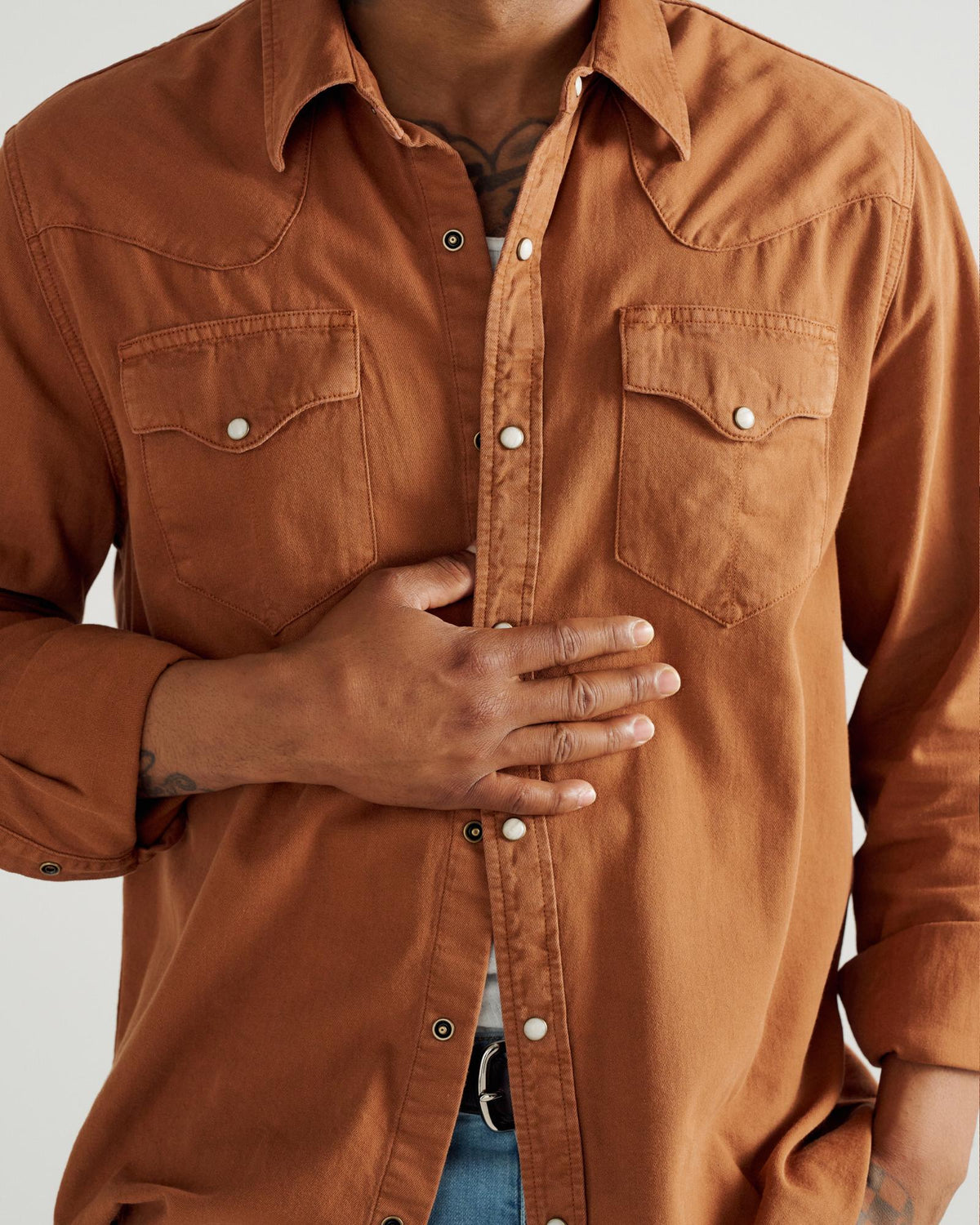 Closeup detail view of Men's Denim Long Sleeve Pearl Snap - Rust