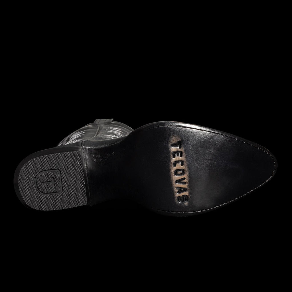 Sole of a black cowboy boot with "TECOVAS" engraved on the heel.