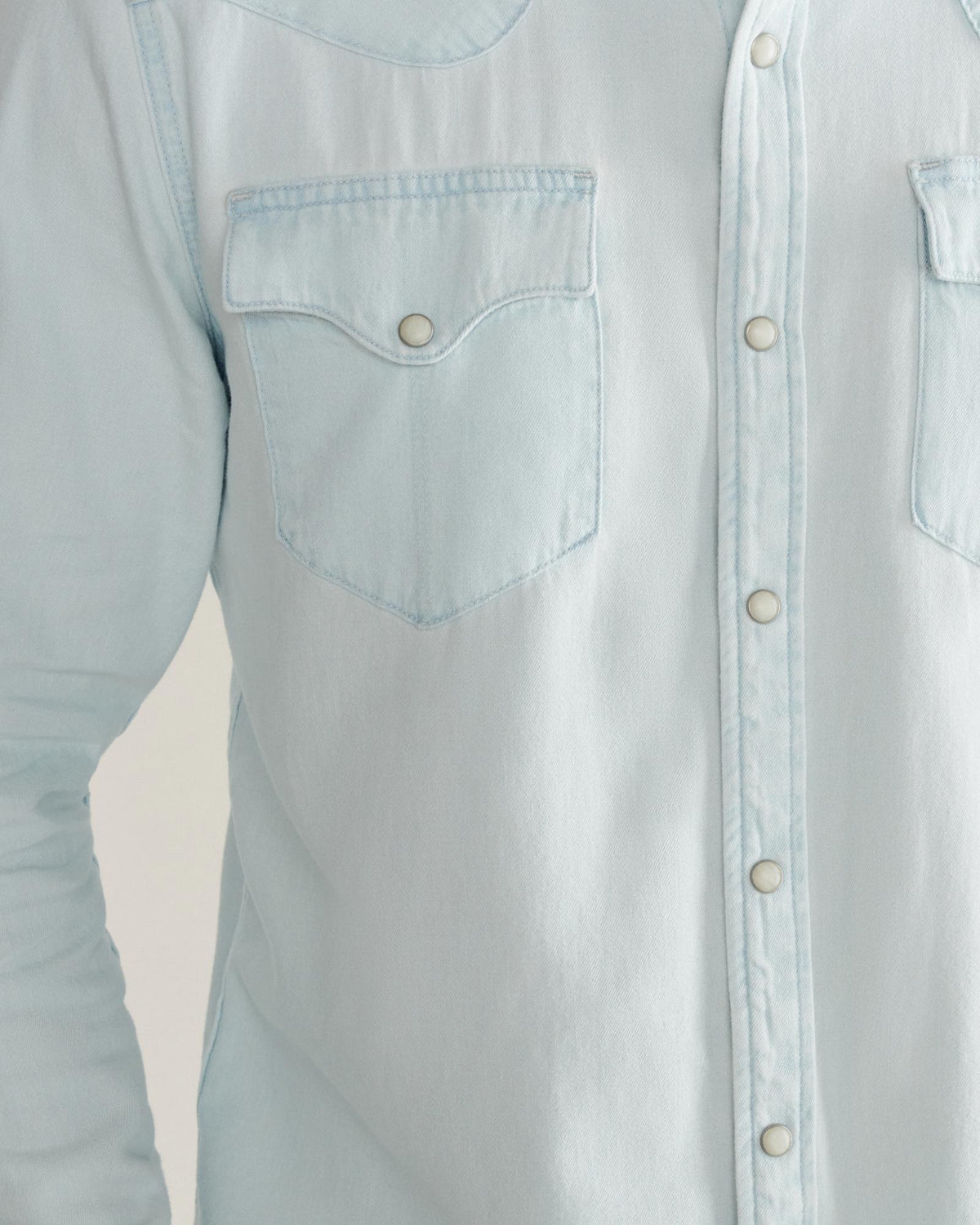 Closeup detail view of Men's Denim Long Sleeve Pearl Snap - Ultra Light