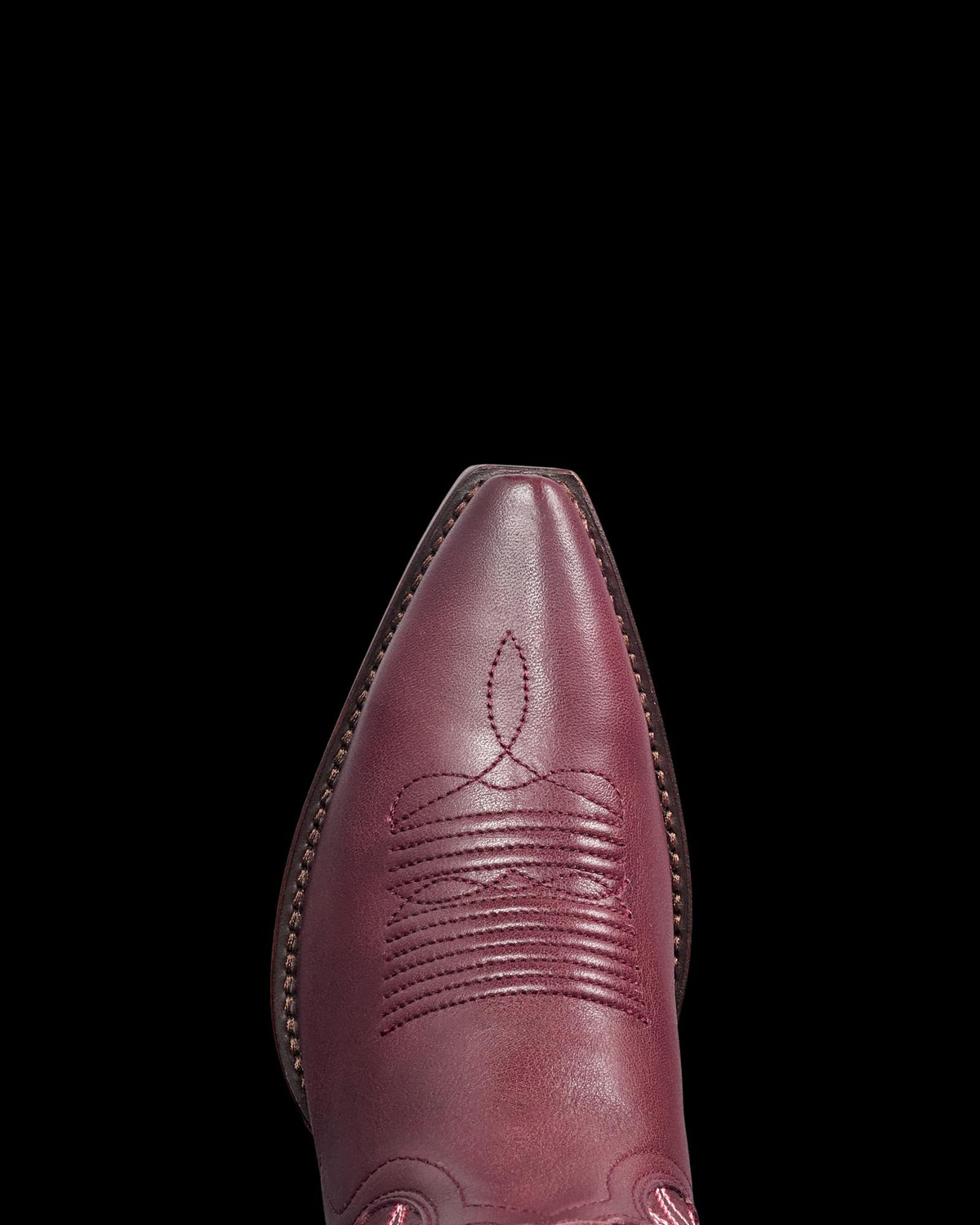 Toe view of The Lynn - Wine Cowhide on plain background