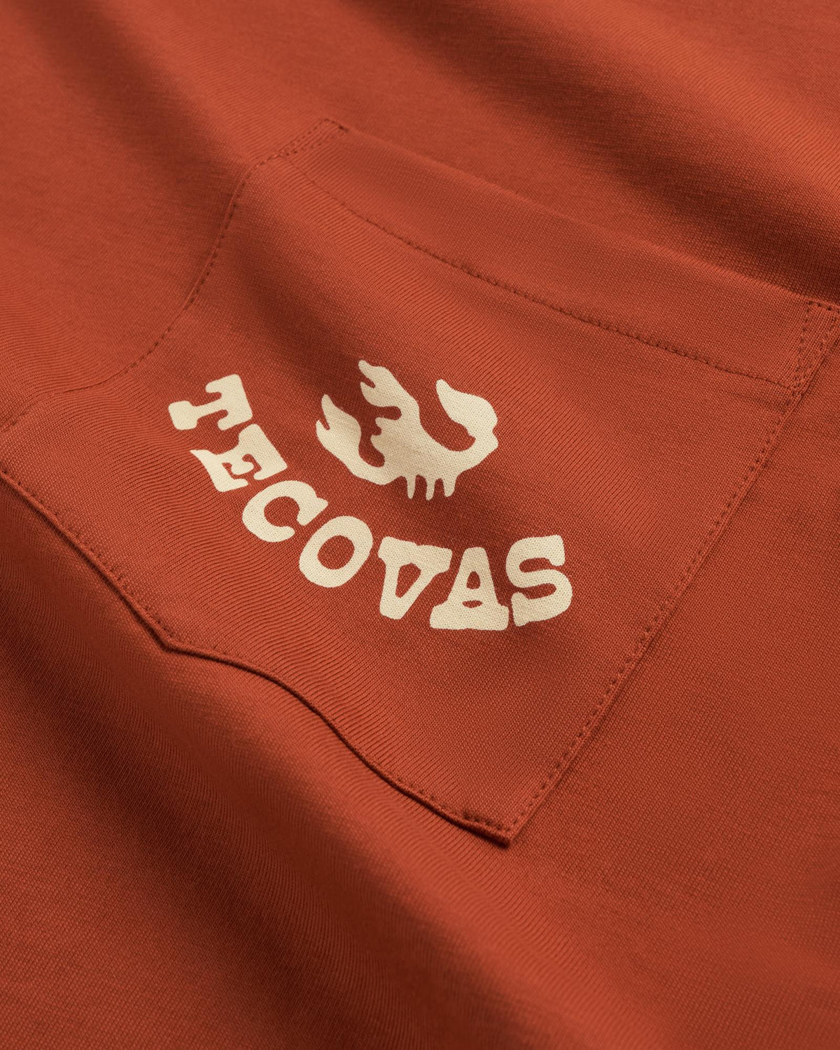 Closeup detail view of Men's Can't Stop Pocket T-Shirt - Orange Rust/Bone