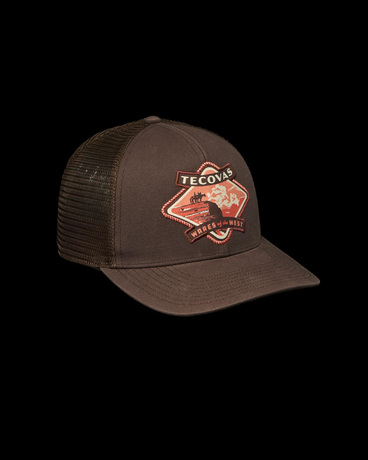 Quarterfront view of Tecovas Wares of the West Trucker - Dark Brown on plain background