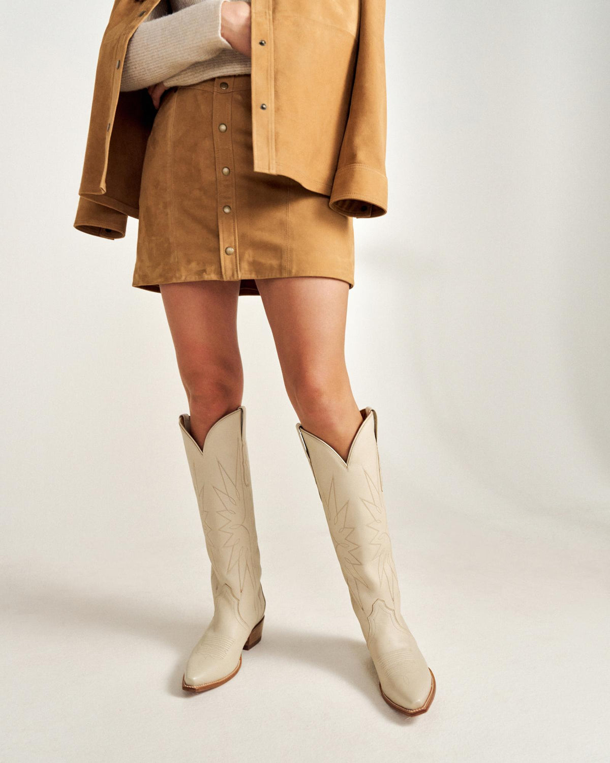 Front view of The Loretta - Cream on model