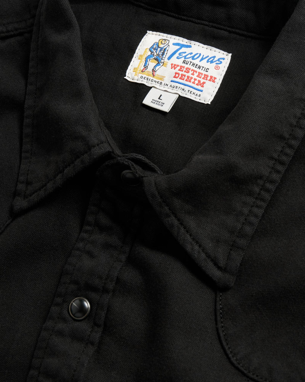 Closeup detail view of Men's Denim Long Sleeve Pearl Snap - Black