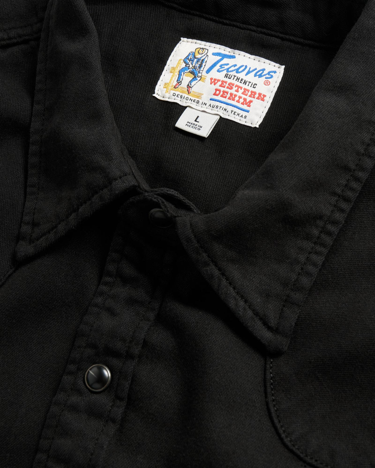 Closeup detail view of Men's Denim Pearl Snap SS - Black