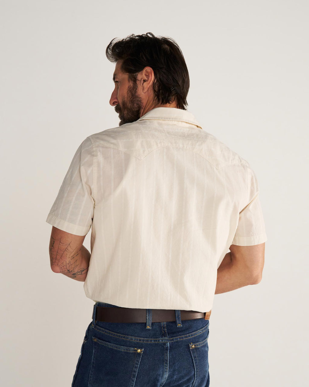 Closeup detail view of Men's Vintage Weight Short Sleeve Pearl Snap - Light Sand/Multi