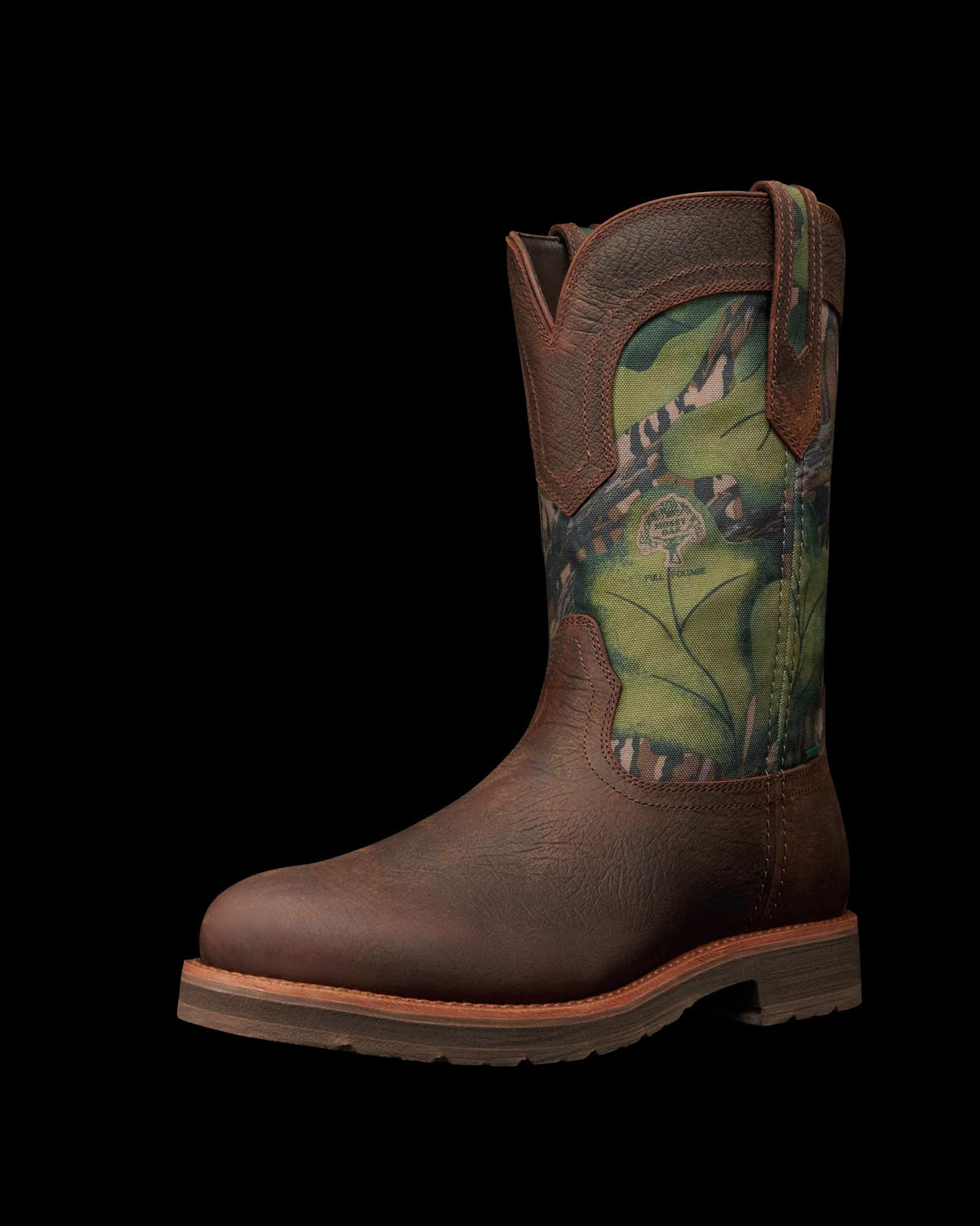 Quarterfront view of Tecovas x Mossy Oak Rugged Roper - Full Foliage Cowhide on plain background