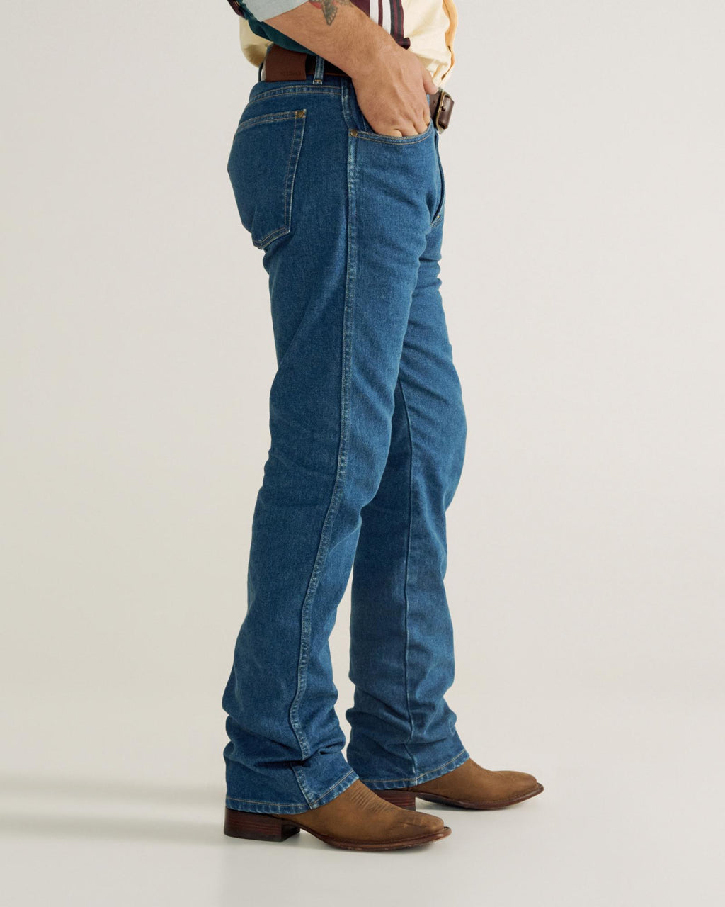 Front view of Men's Modern Bootcut Heritage Denim - Medium Blue on model