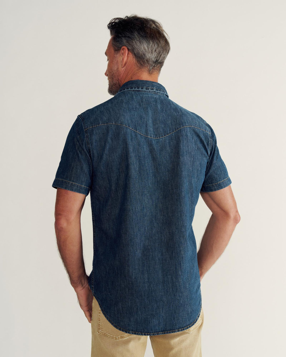 Closeup detail view of Men's Denim Short Sleeve Pearl Snap - Dark Wash