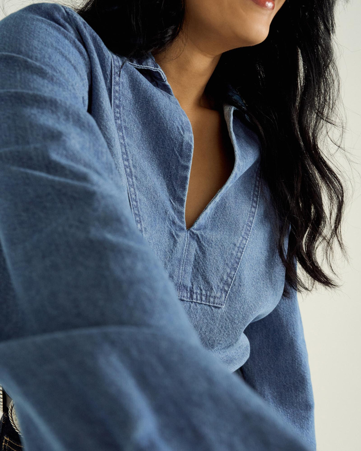 Front view of Women's L/S Denim Popover Top - Medium Wash on model