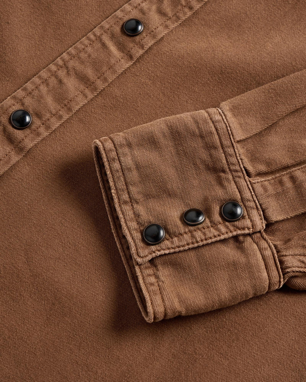 Closeup detail view of Men's Denim Pearl Snap - Tobacco