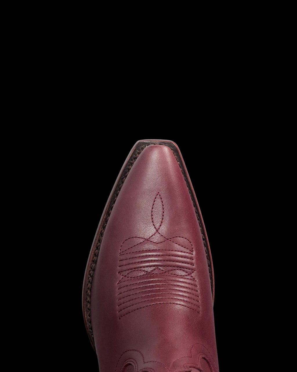 Toe view of The Annie Hearts - Wine Cowhide on plain background