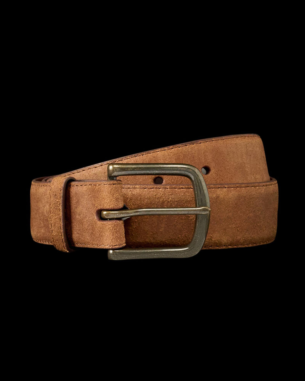 A brown suede leather belt with a brass buckle, coiled neatly against a plain white background.