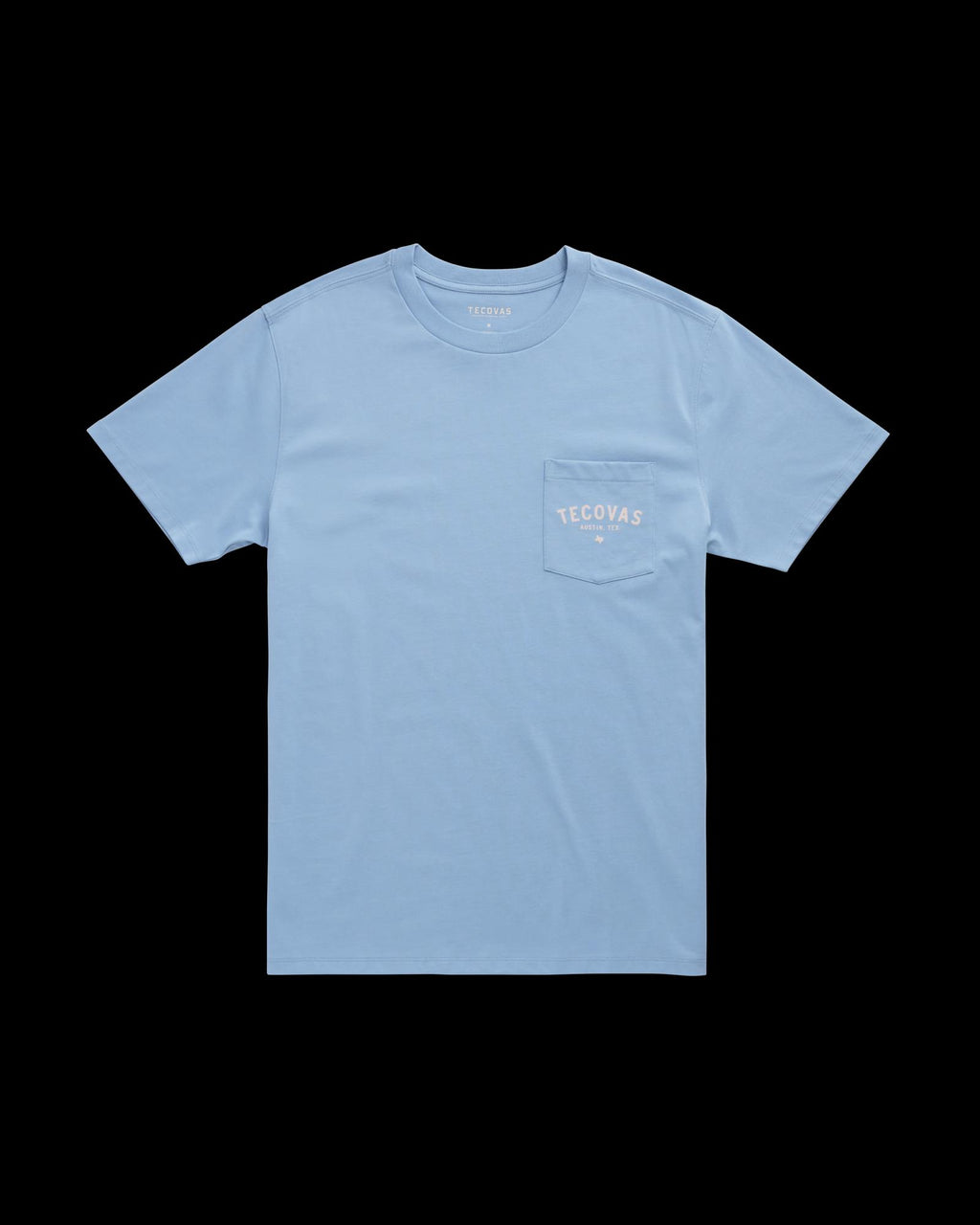 Light blue short-sleeve T-shirt with a chest pocket on the left side featuring the white Tecovas logo.