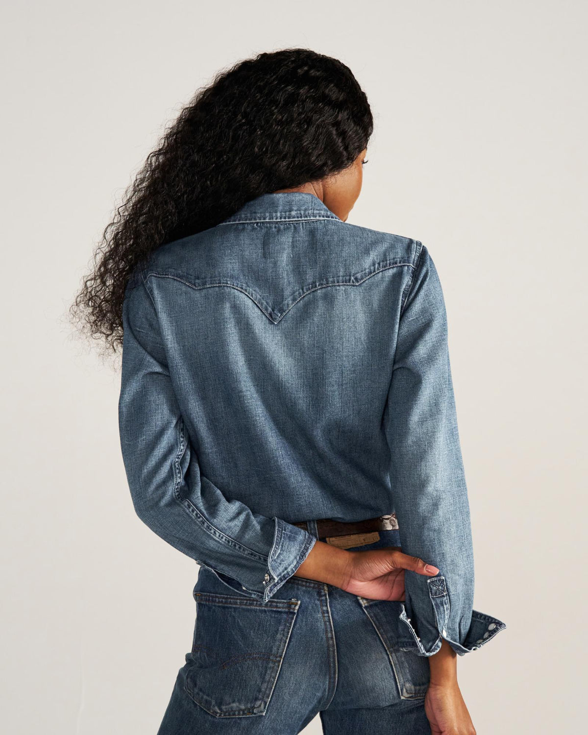 Closeup detail view of Women's Denim Pearl Snap (III) - Medium Wash