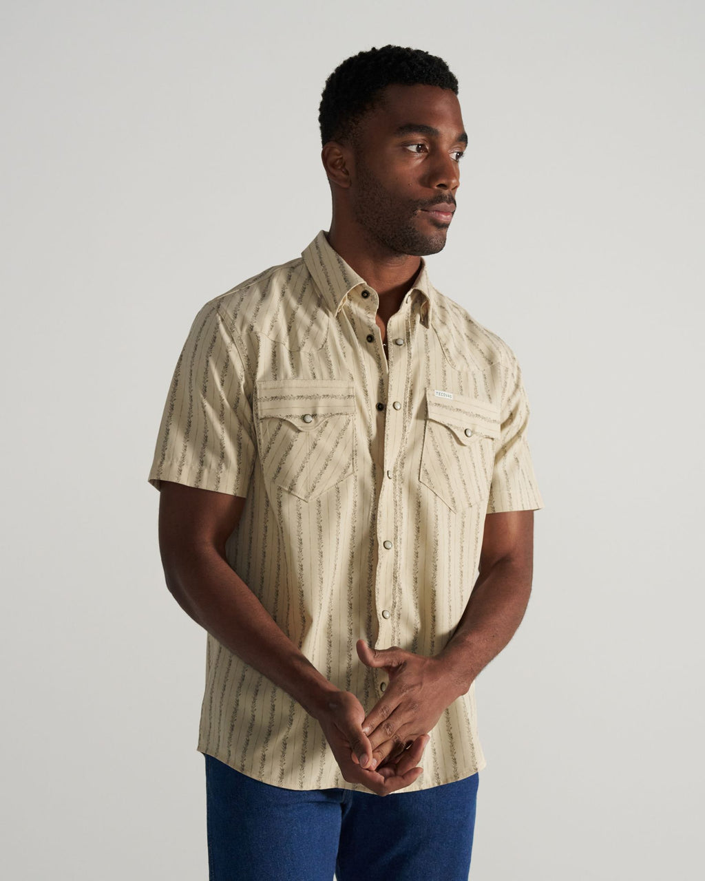 Closeup detail view of Men's Performance Western Short Sleeve Pearl Snap - Sandstone/Multi