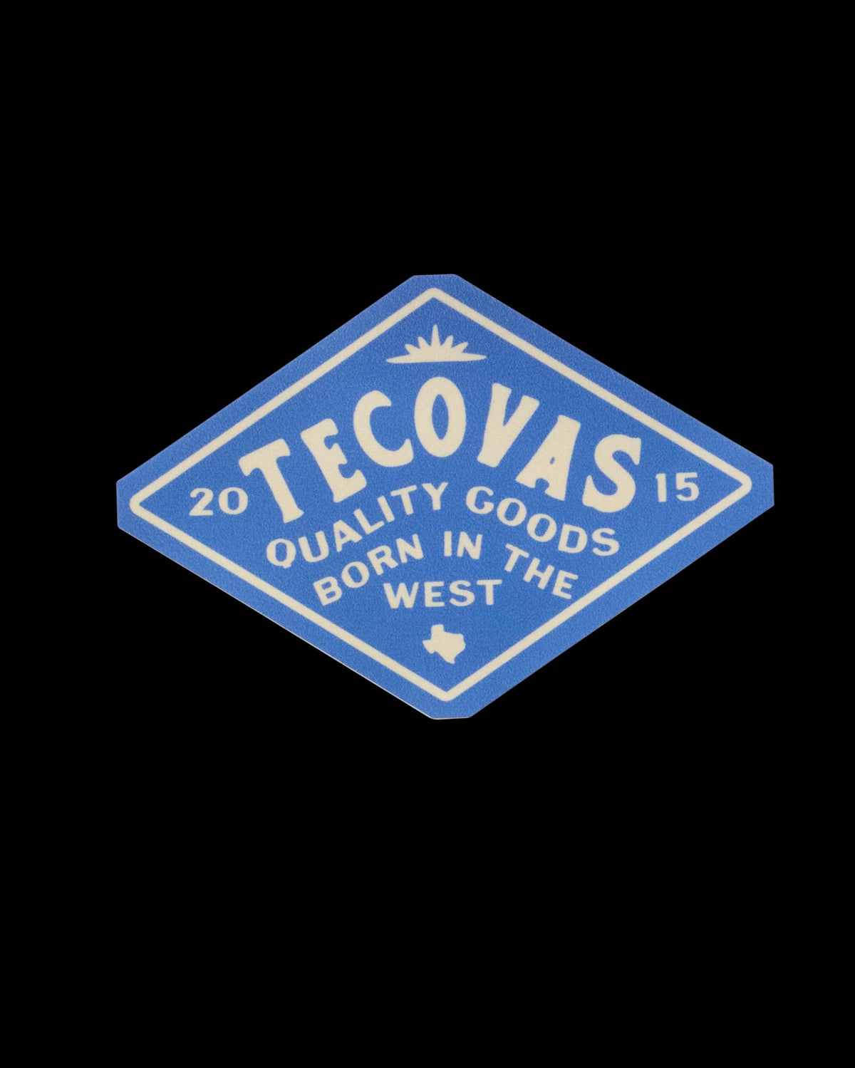 Blue diamond-shaped Tecovas logo with "Quality Goods Born in the West" and "2015" text. Includes a small Texas silhouette.