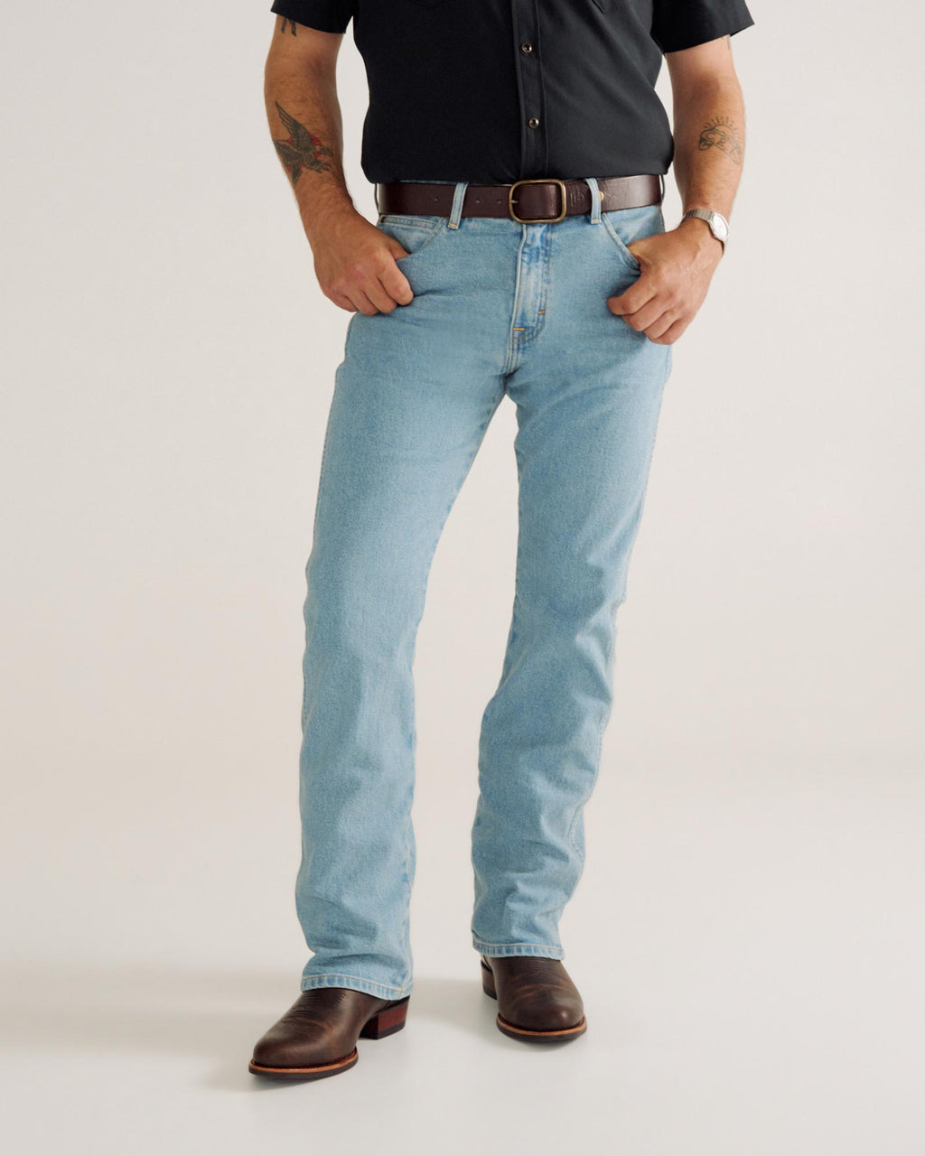 Front view of Men's Modern Bootcut Heritage Denim - Light Blue on model