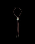 Front view of Iron Lamb Turquoise Drop Bolo - Turquoise/Brown on plain background