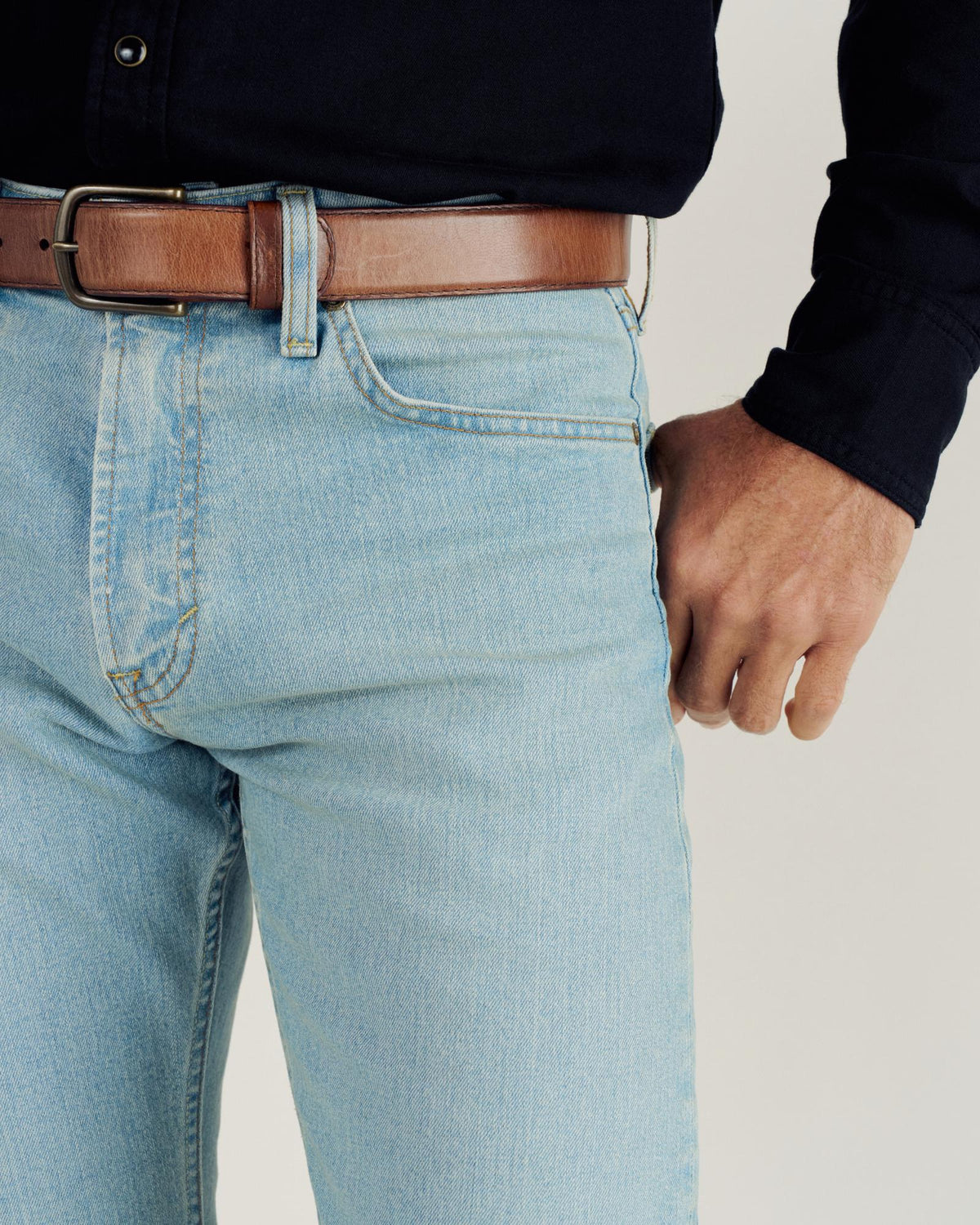 Closeup detail view of Men's Slim Straight Stretch Denim - Light Stone Wash