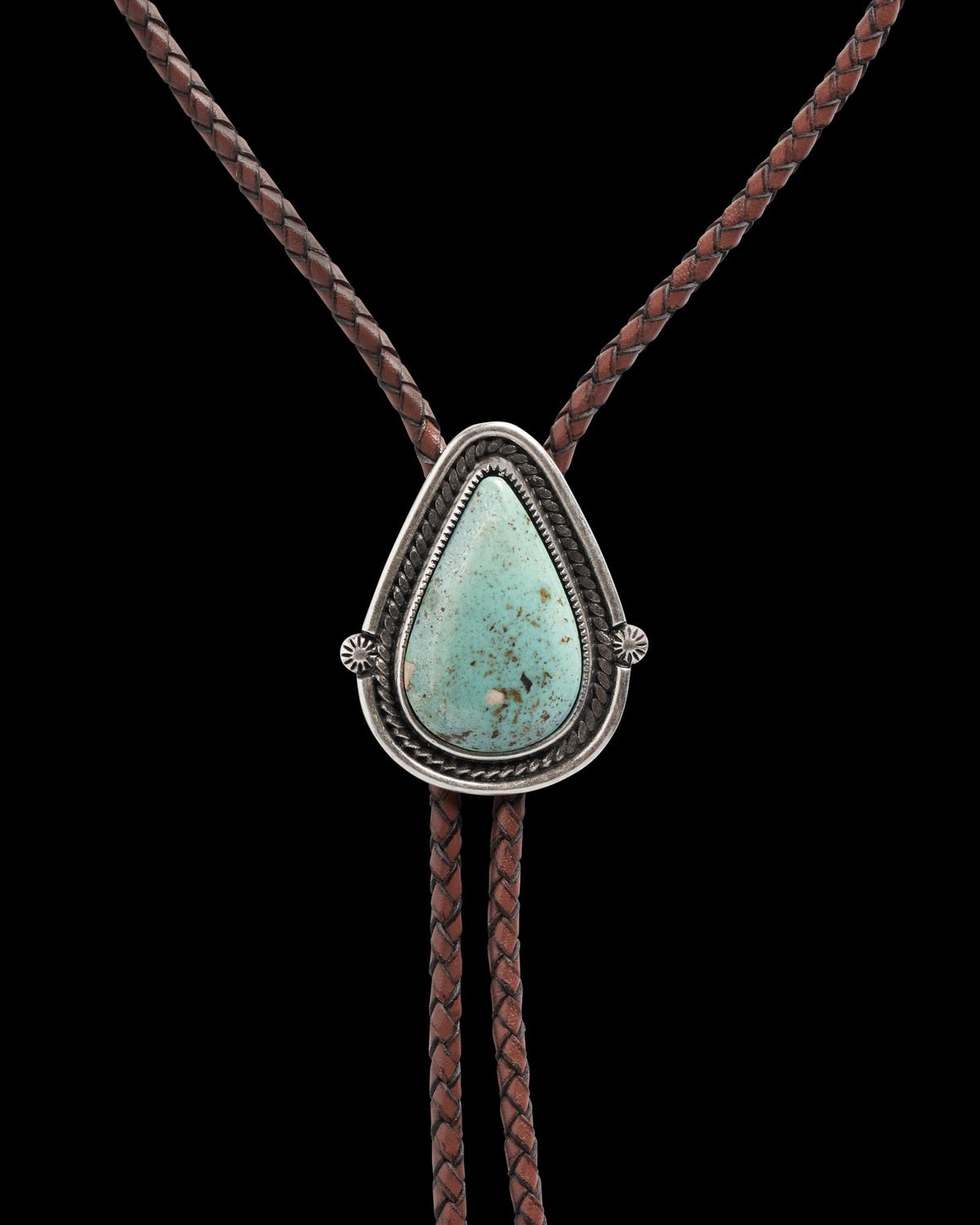Closeup detail view of Iron Lamb Turquoise Drop Bolo - Turquoise/Brown