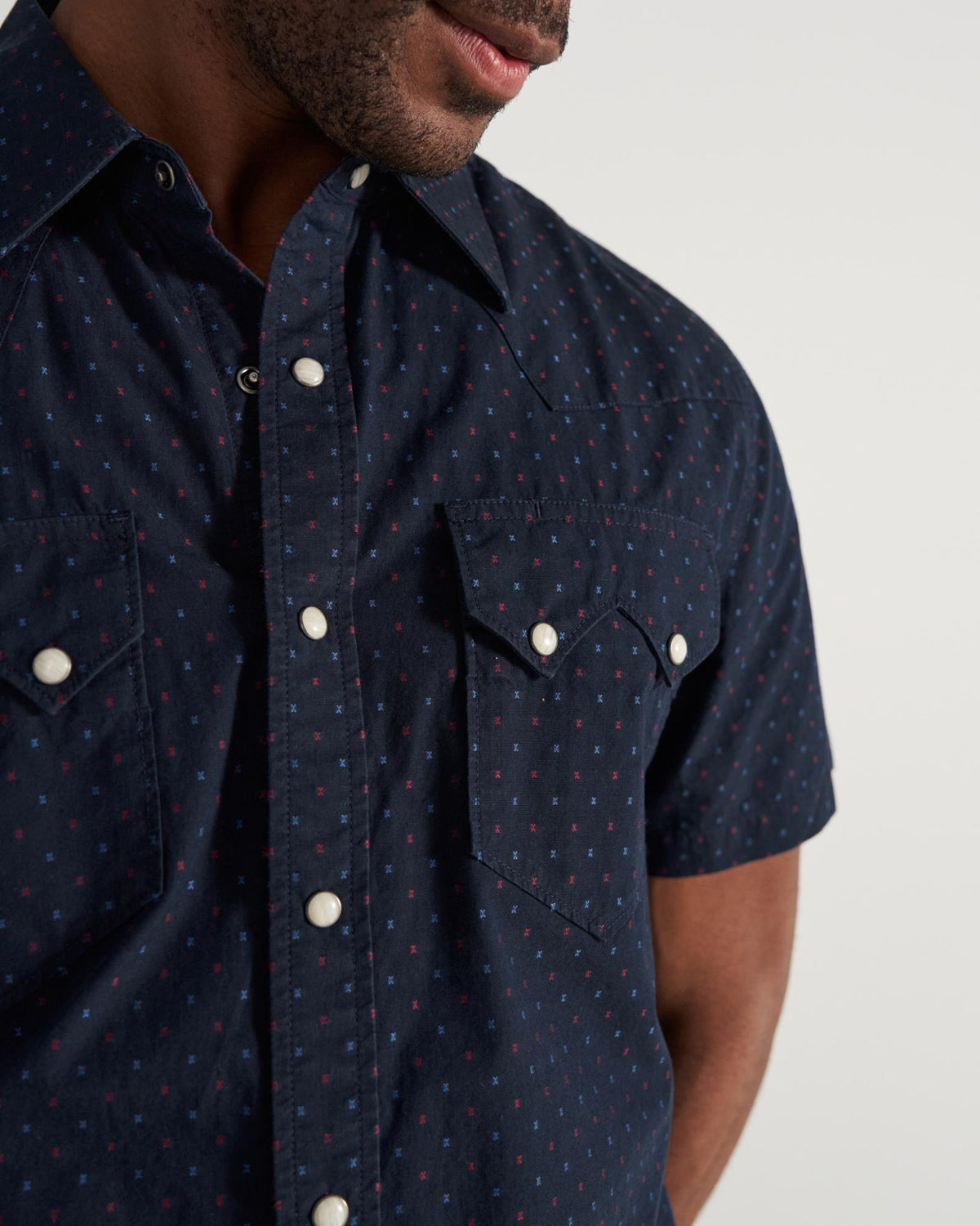 Closeup detail view of Men's Star Stitch Pearl Snap - Navy