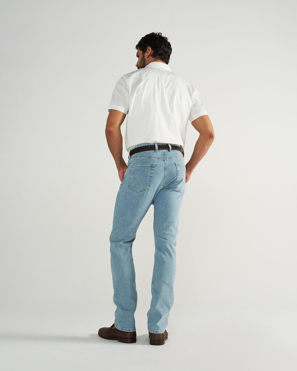 Back view of Men's Slim Stretch Denim - Light Stone Wash on model