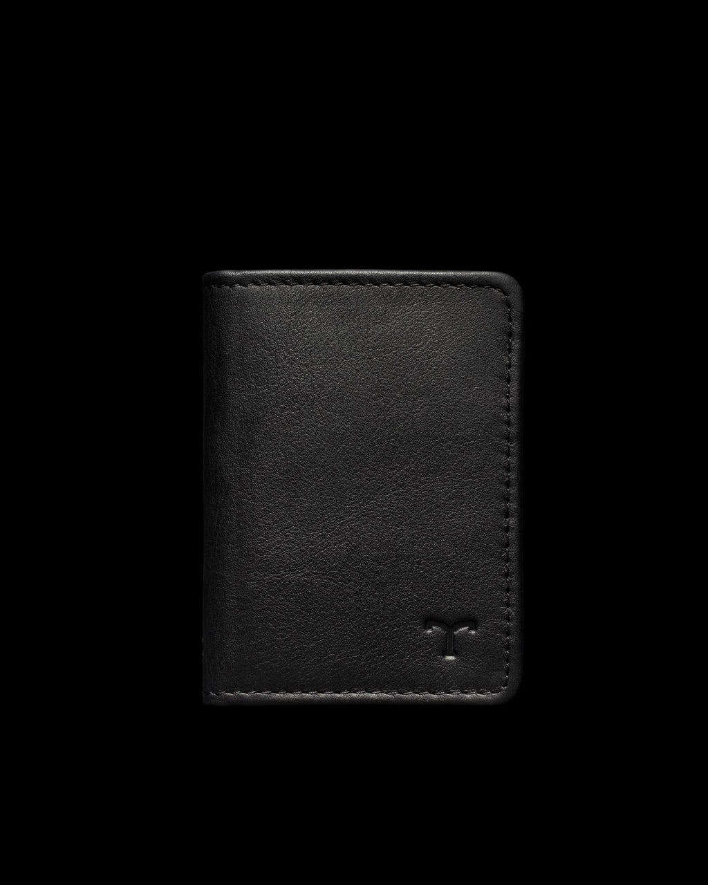 A black leather wallet with a small embossed logo on the lower right corner against a plain dark background.