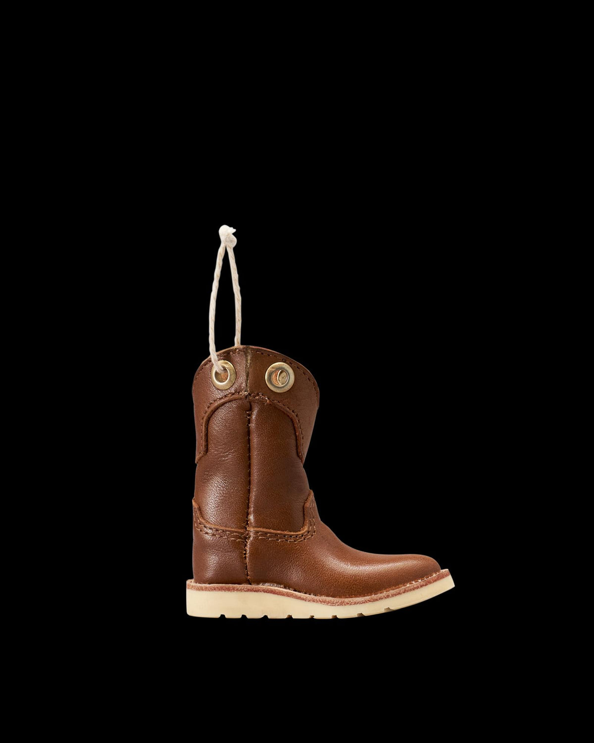 Profile view of LongHaul Roper Work Boot Ornament - Saddle on plain background