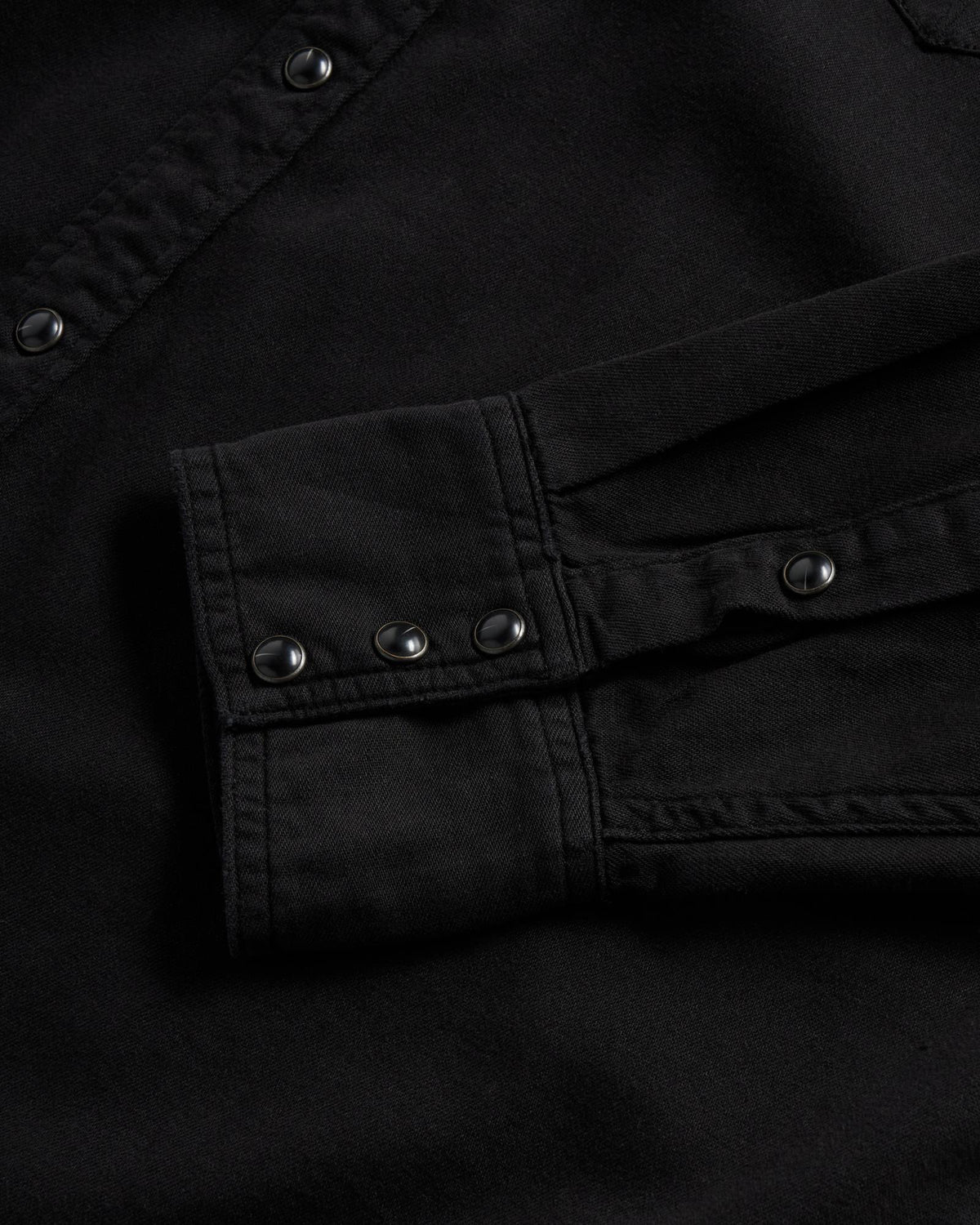 Closeup detail view of Men's Denim Long Sleeve Pearl Snap - Black