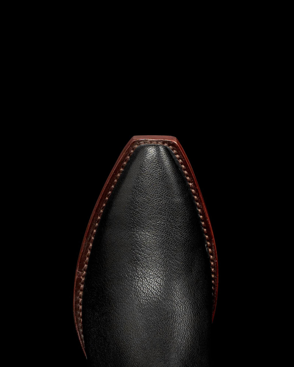 Toe view of The Piper II - Midnight Goat on plain background