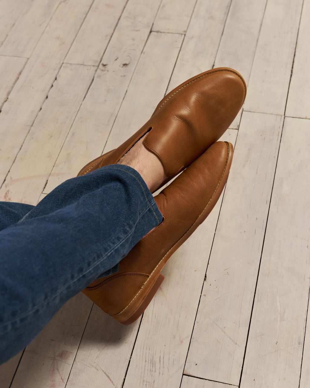 Closeup of man wearing the Monterrey slip on in Butterscotch in a photo studio