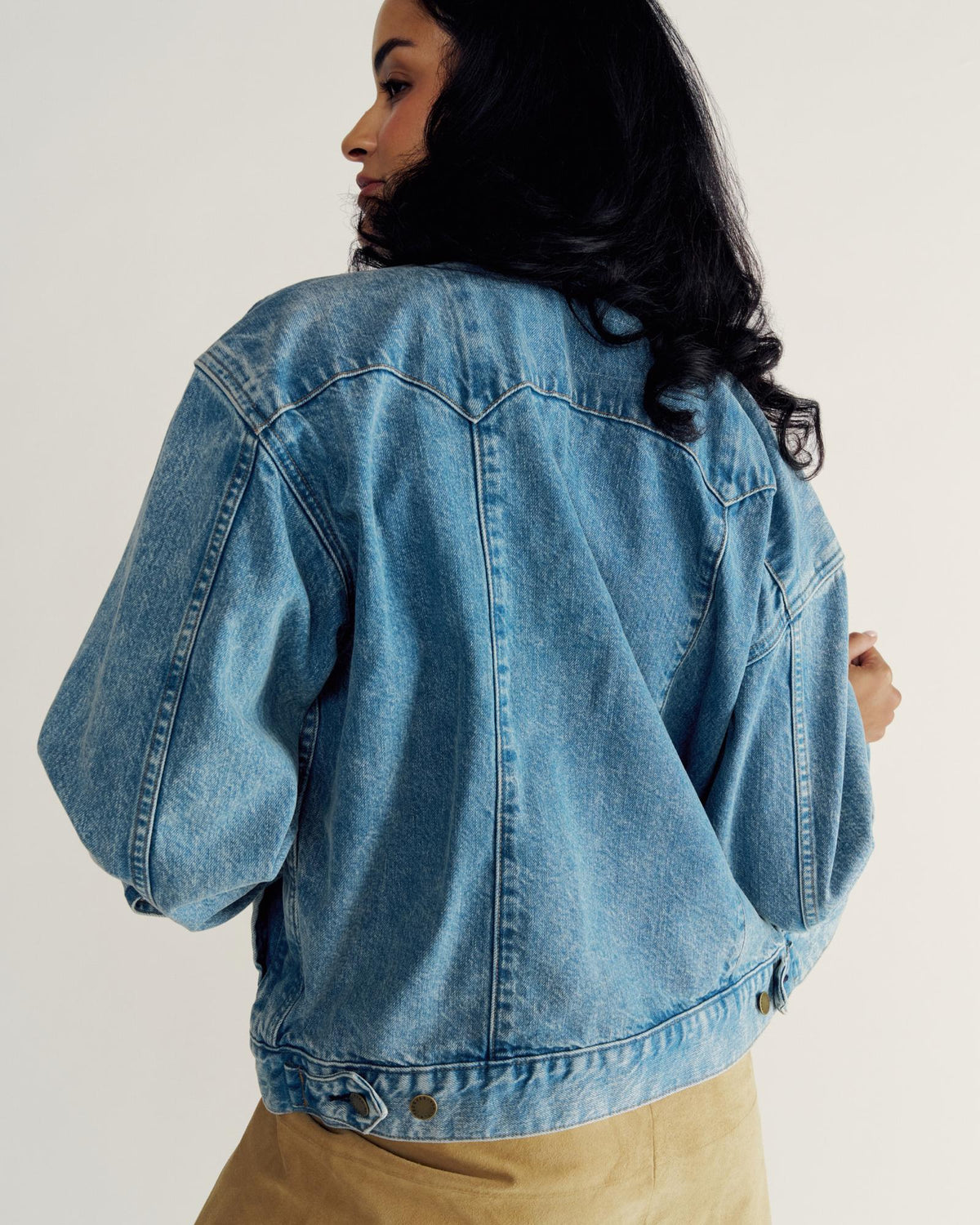 Back view of Women's Denim Trucker Jacket - Medium Wash on model
