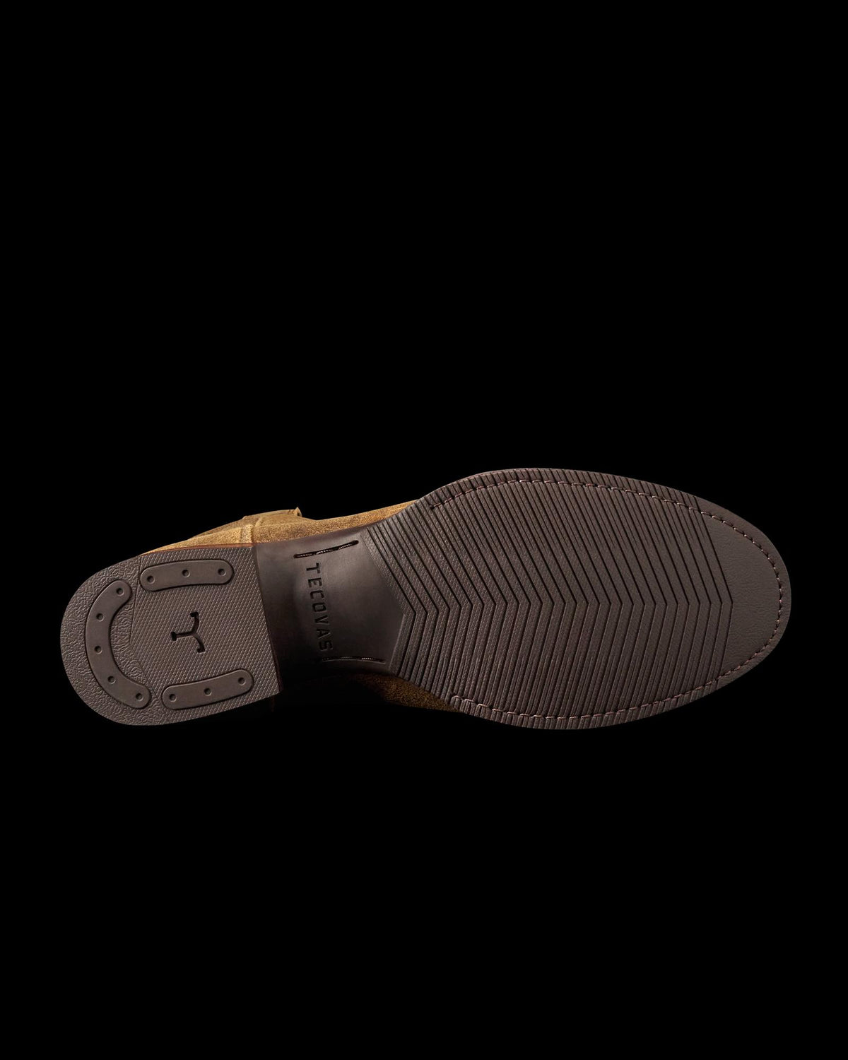 Bottom view of The Glen Roughout dress shoe in Dustwood, featuring a textured rubber sole with branding and a durable rubber heel for added traction.