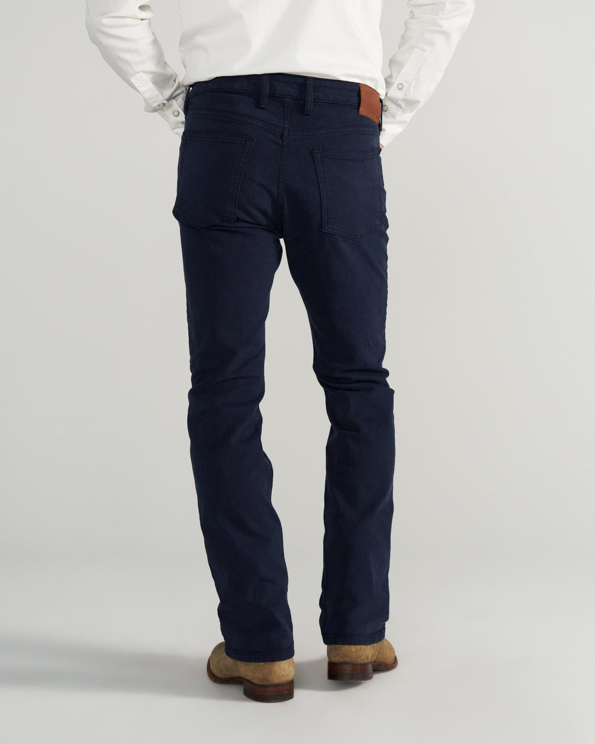 Back view of Men's Slim Straight Stretch Twill - Dark Navy on model
