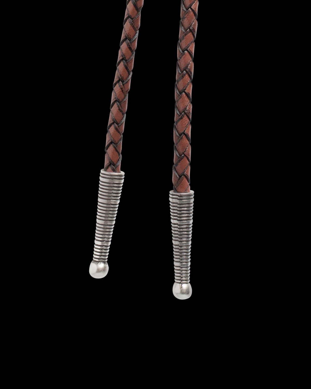 Closeup view of Iron Lamb Fossilized Coral Bolo - Cream / Black