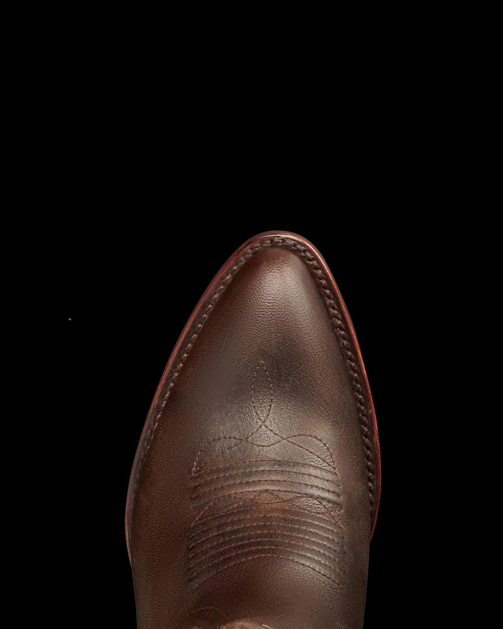 Toe view of The Abby - Mocha Goat on plain background