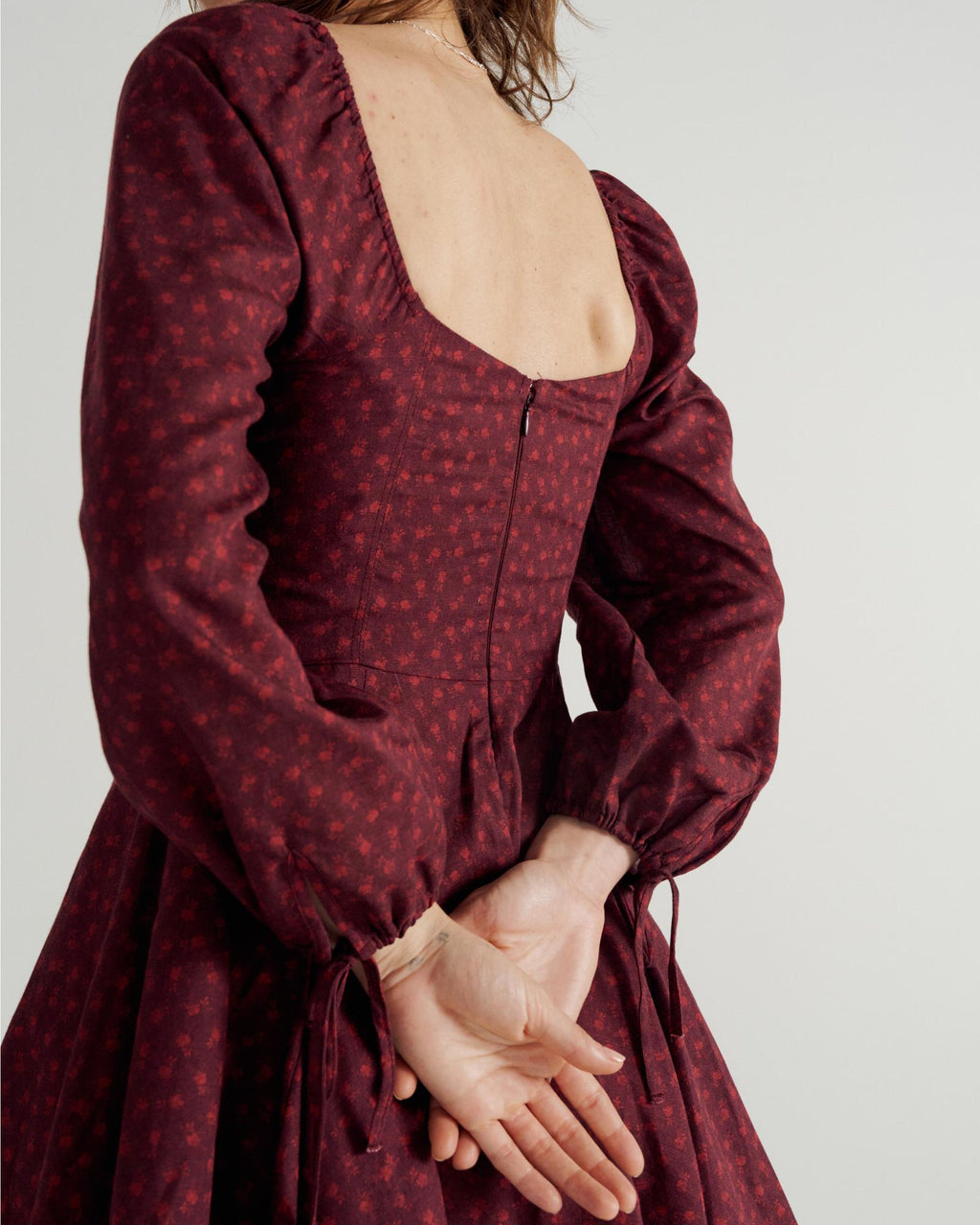 Back view of Women's L/S Mini Dress - Burgundy Floral on model