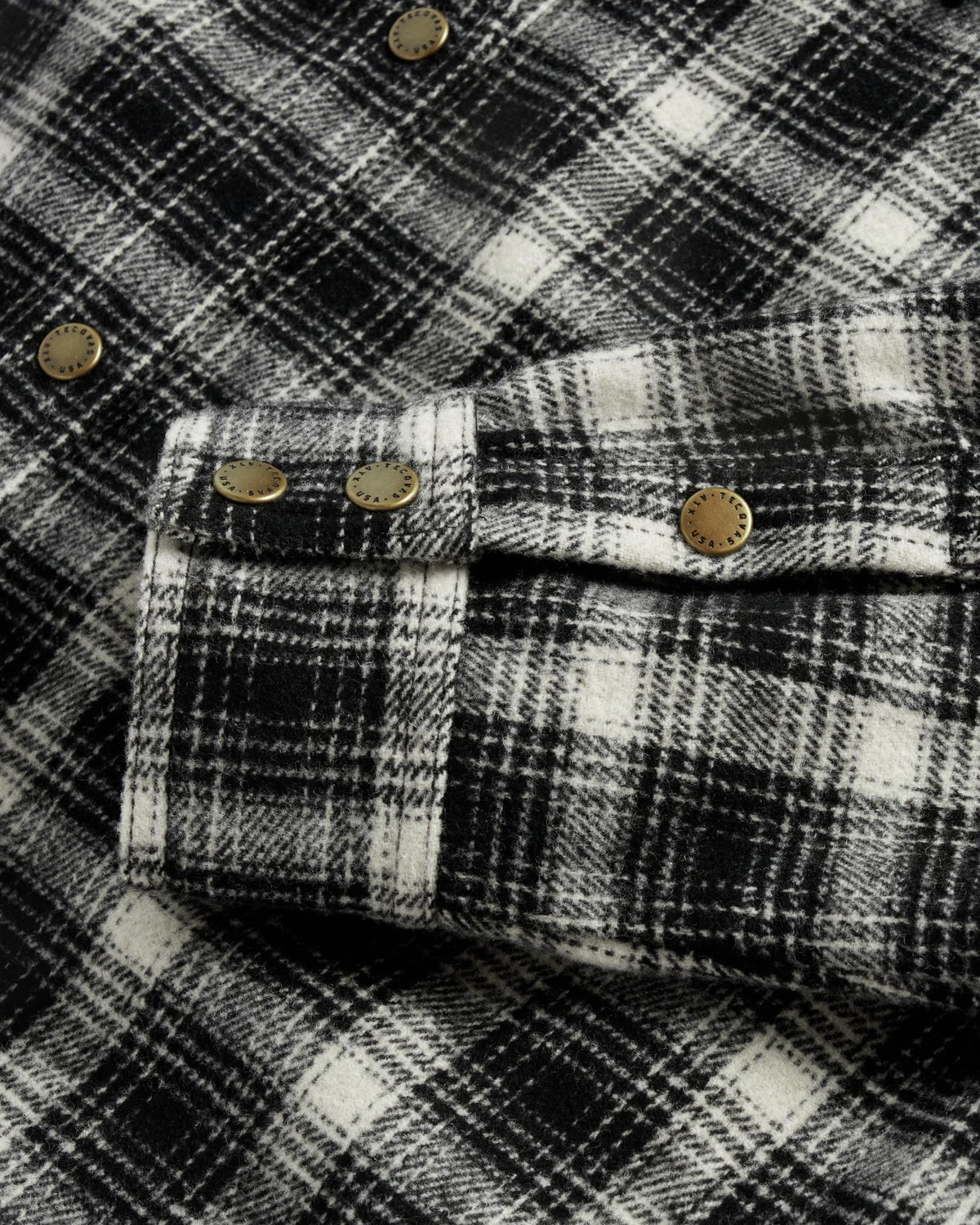 Closeup detail view of Women's Plaid Fringe Shacket - Black / White