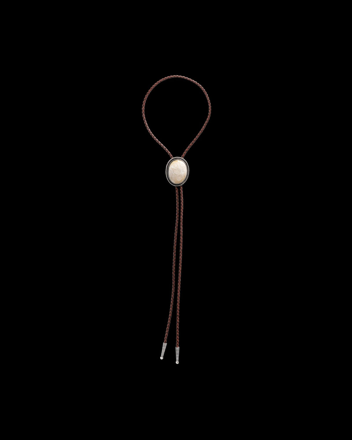 Front view of Iron Lamb Fossilized Coral Bolo - Cream / Black on plain background