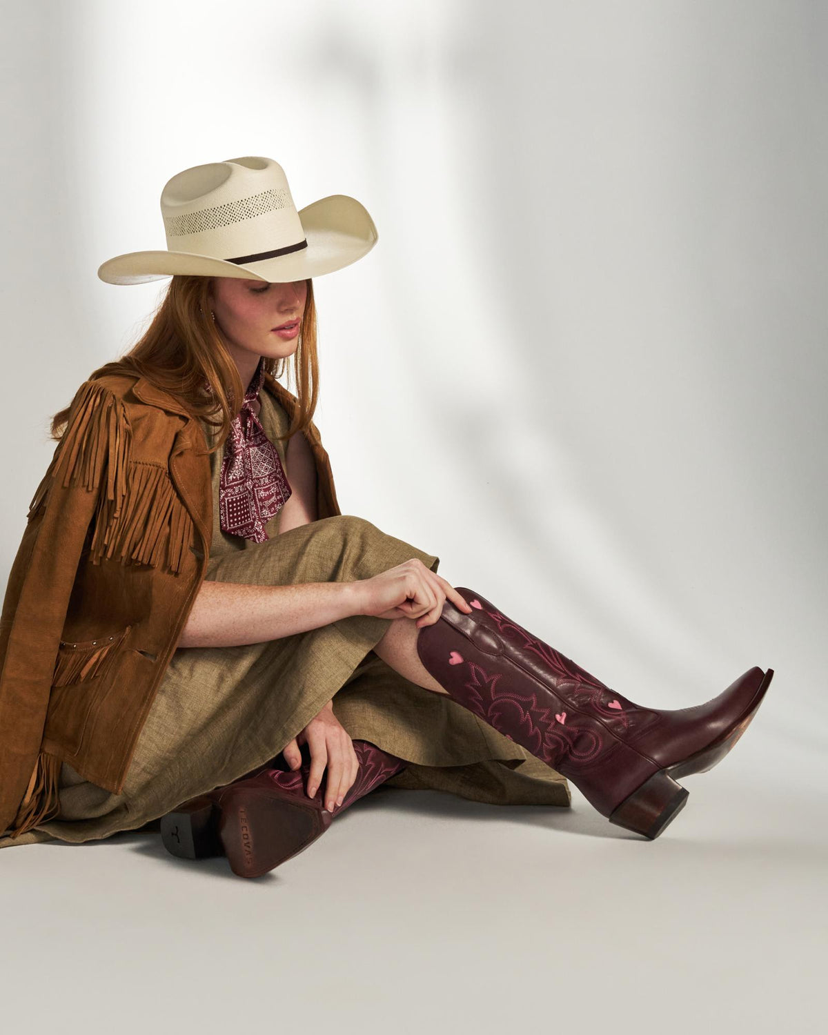 Full view of The Annie Hearts - Wine Cowhide on model