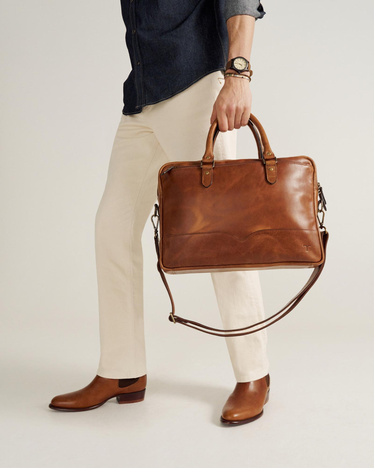 image of man carrying briefcase