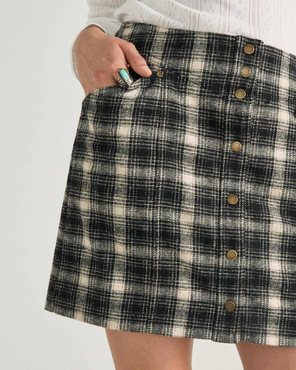 Closeup view of Women's Plaid Mini Skirt - Black / White