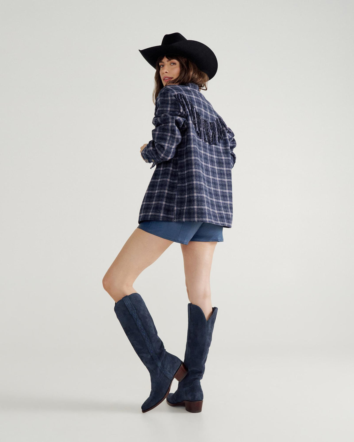 Closeup detail view of Women's Plaid Fringe Shacket - Navy / Mauve