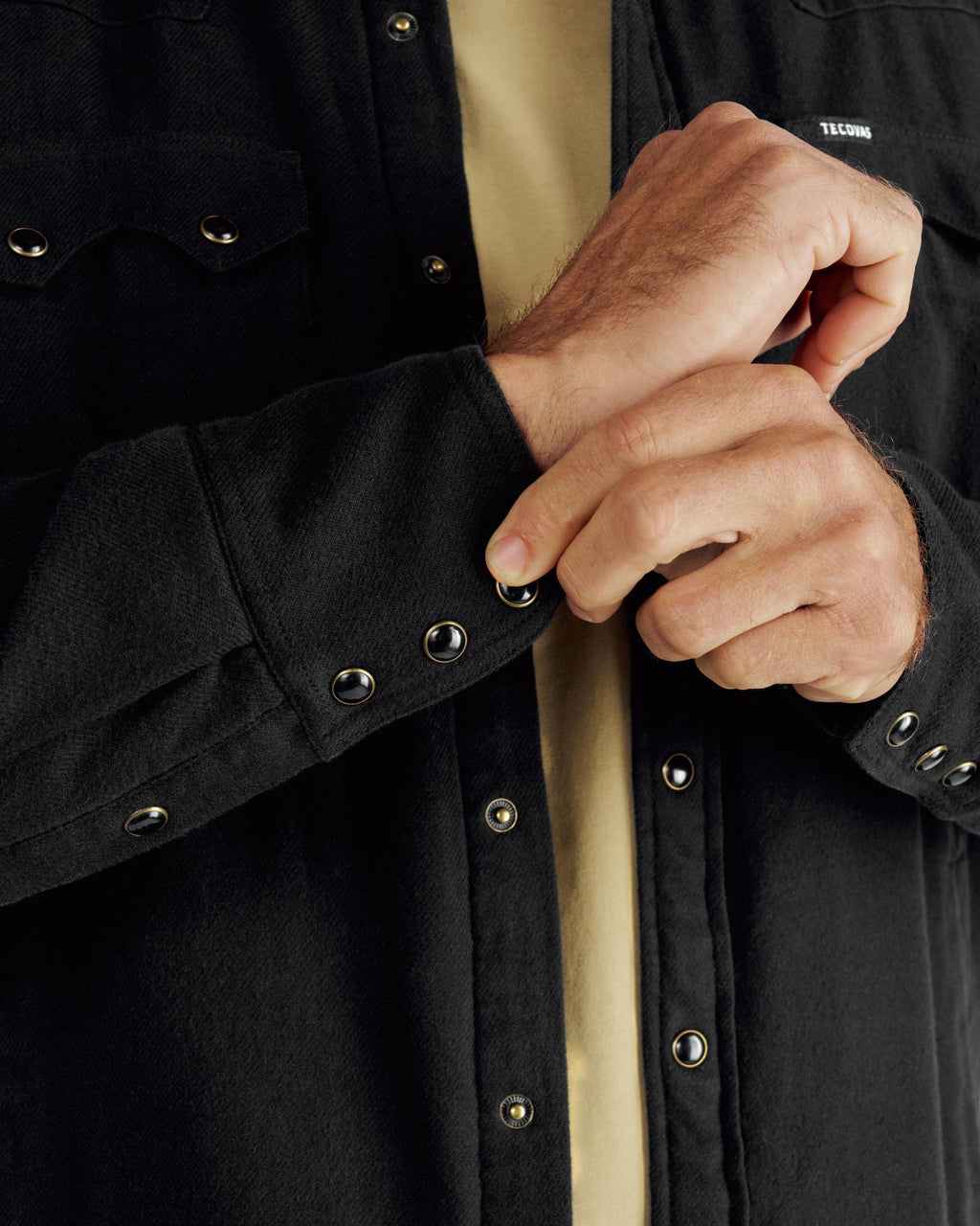 Closeup detail view of Men's Sawtooth Pearl Snap Shacket - Black